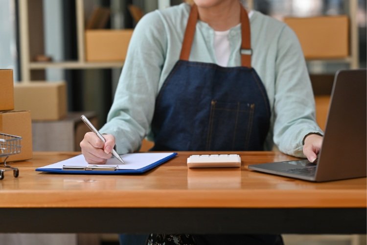 Lady sitting at her desk working on her new business