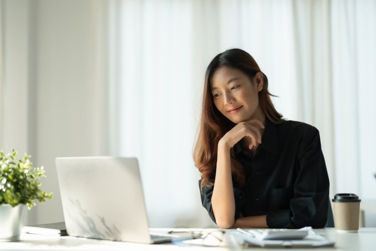 Lady looking at her laptop
