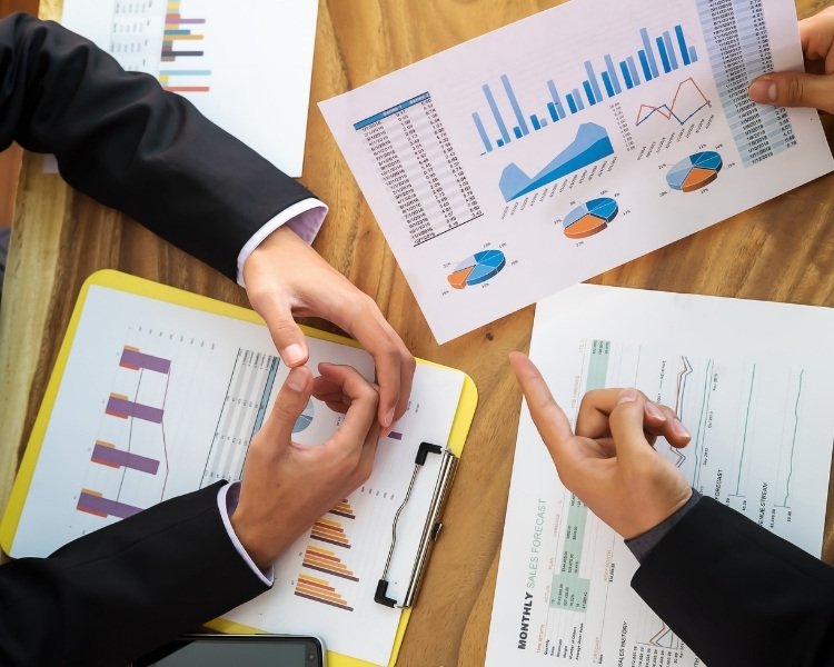 2 people looking through figures together